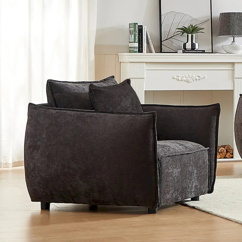 Fauteuil d'appoint en chenille noire avec coussins décoratifs, assise large et foncée