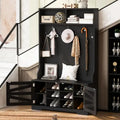 Portemanteau d'entrée noir avec armoire à chaussures, banc et patères