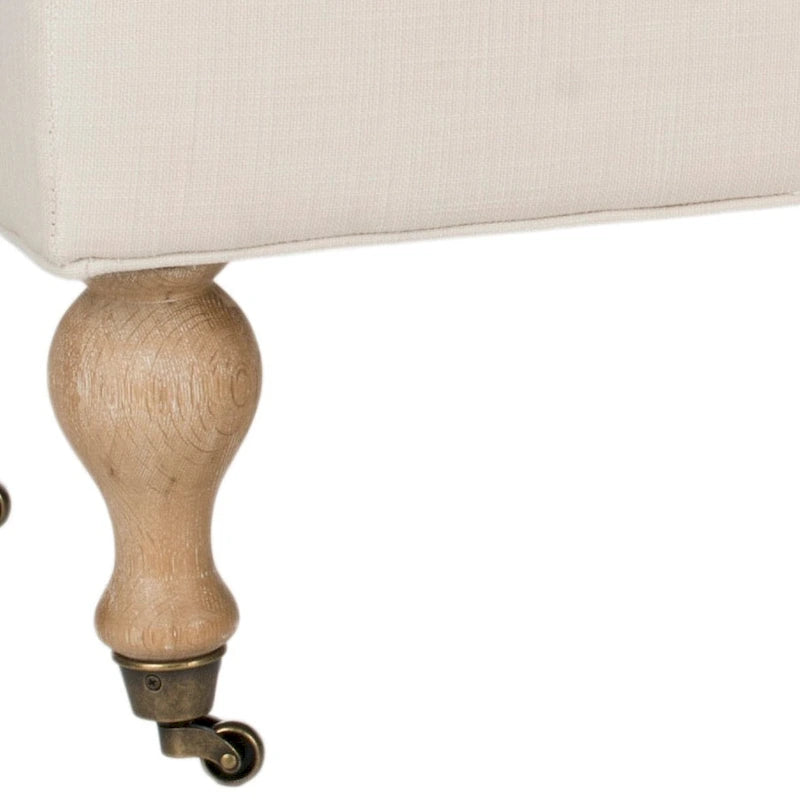 Banc ottoman rembourré à dessus oreiller avec pieds tournés et roulettes, Gris Acier