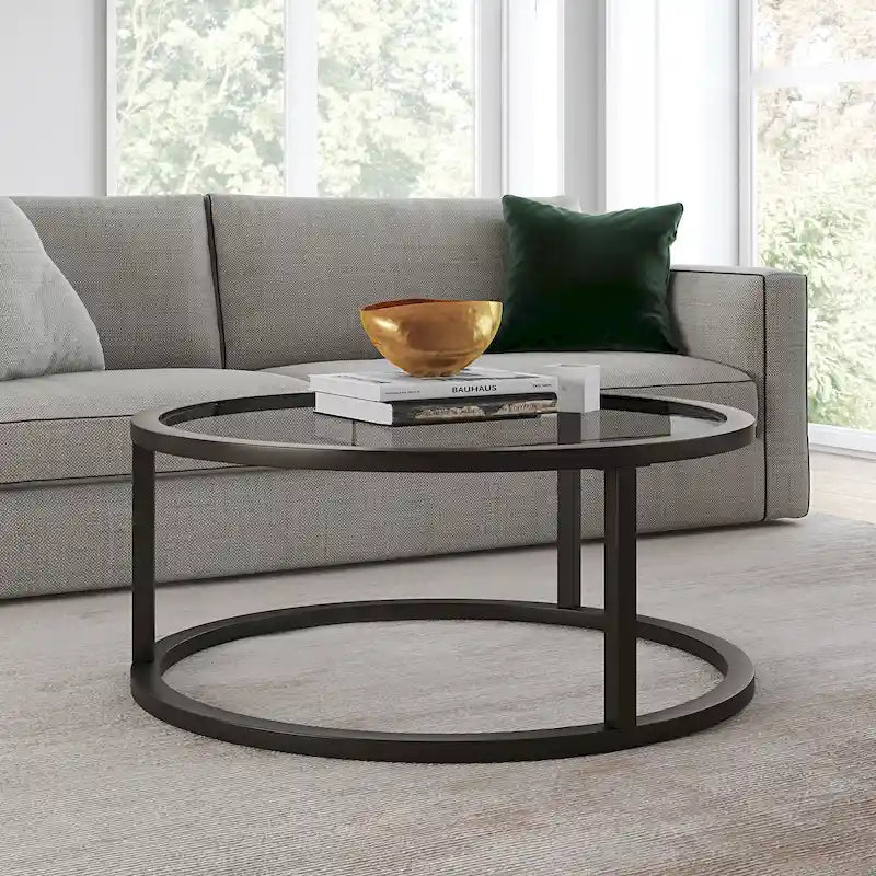 Table basse ronde avec plateau en verre trempé et cadre en acier finition laiton