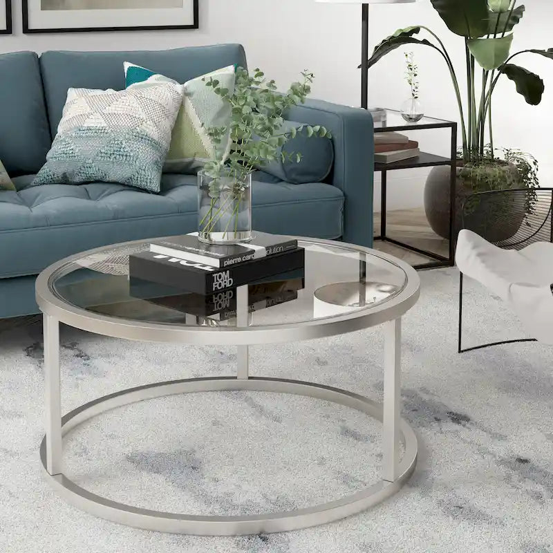 Table basse ronde avec plateau en verre trempé et cadre en acier finition laiton