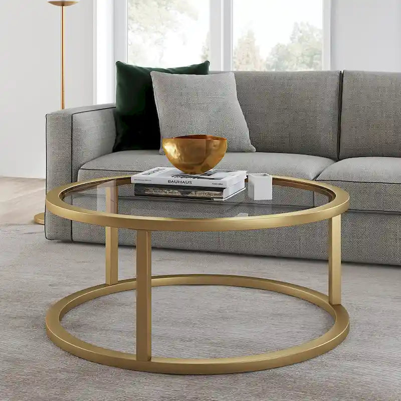 Table basse ronde avec plateau en verre trempé et cadre en acier finition laiton