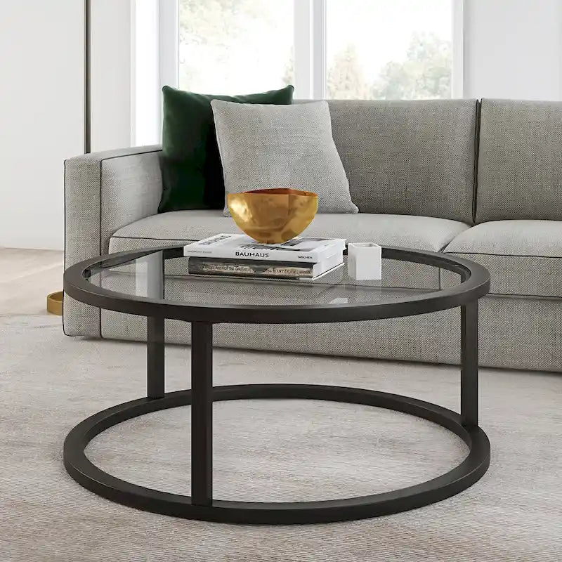 Table basse ronde avec plateau en verre trempé et cadre en acier finition laiton