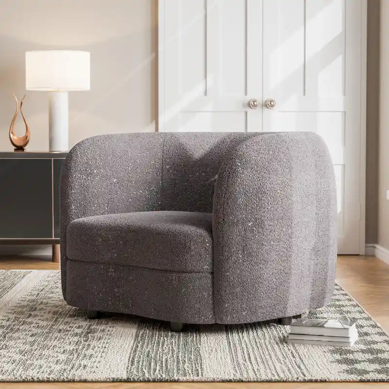Fauteuil d'appoint moderne en bouclette avec accoudoirs incurvés, assise rénale et pieds ronds en bois