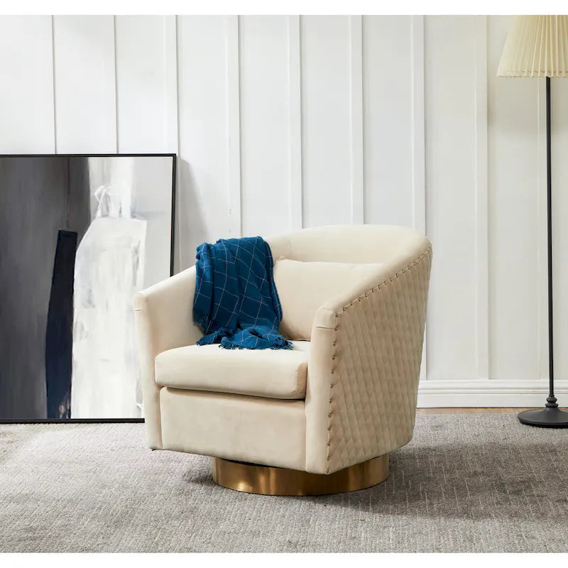Fauteuil pivotant en velours bleu marine matelassé losanges avec garniture cloutée