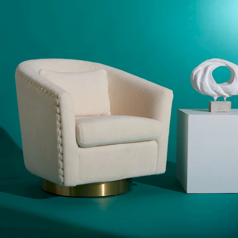 Fauteuil pivotant en velours bleu marine matelassé losanges avec garniture cloutée