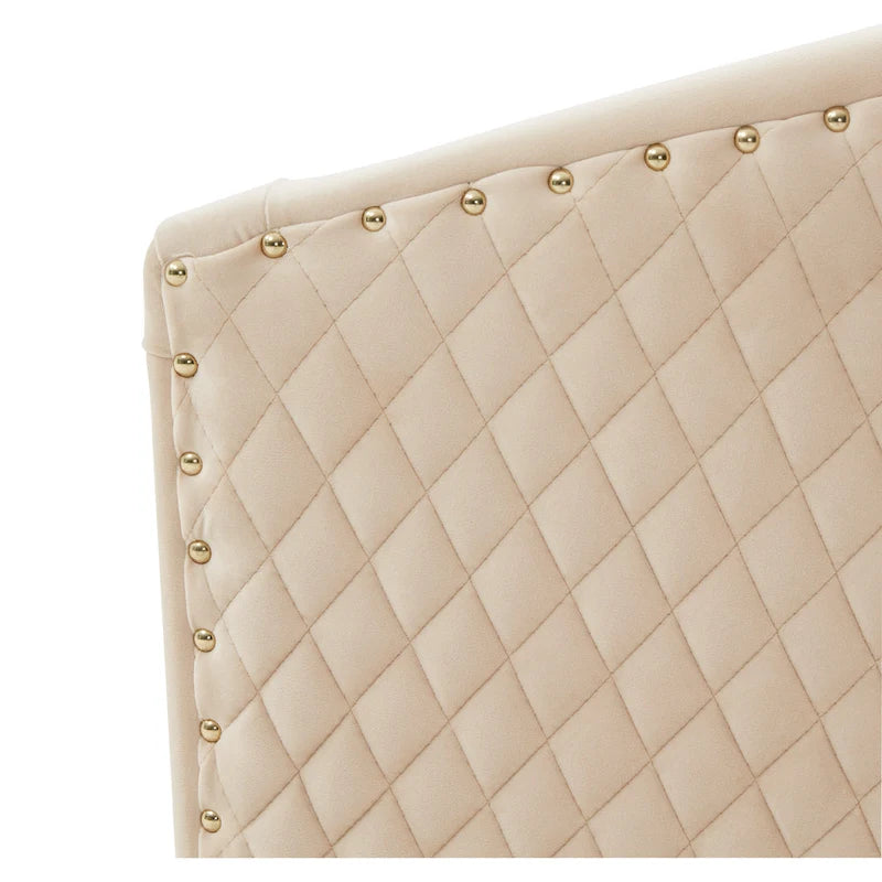 Fauteuil pivotant en velours bleu marine matelassé losanges avec garniture cloutée