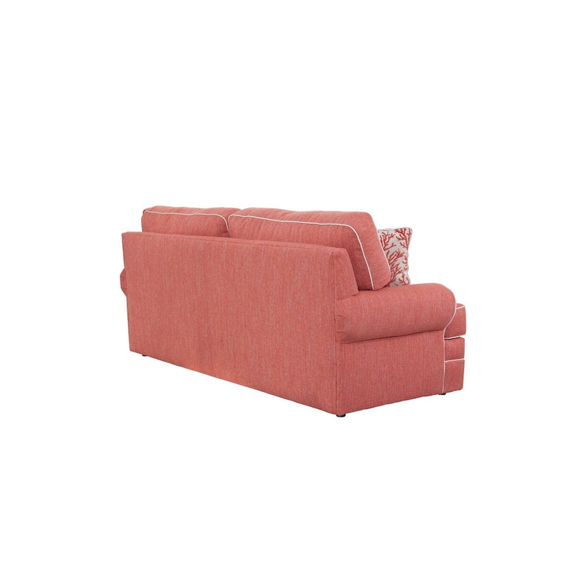 Canapé rond à accoudoirs corail avec passepoil ivoire et coussins d'appoint