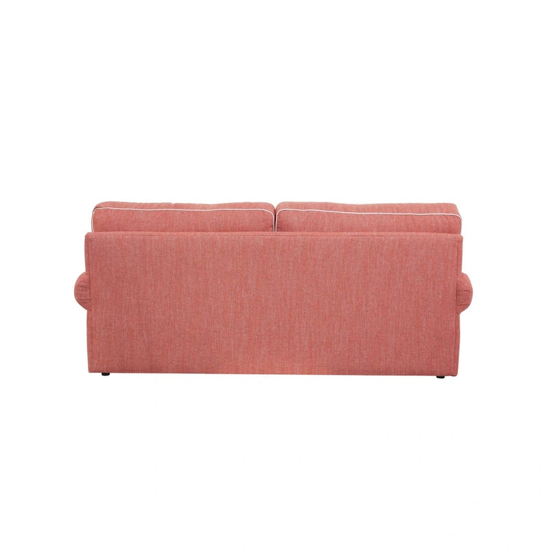 Canapé rond à accoudoirs corail avec passepoil ivoire et coussins d'appoint